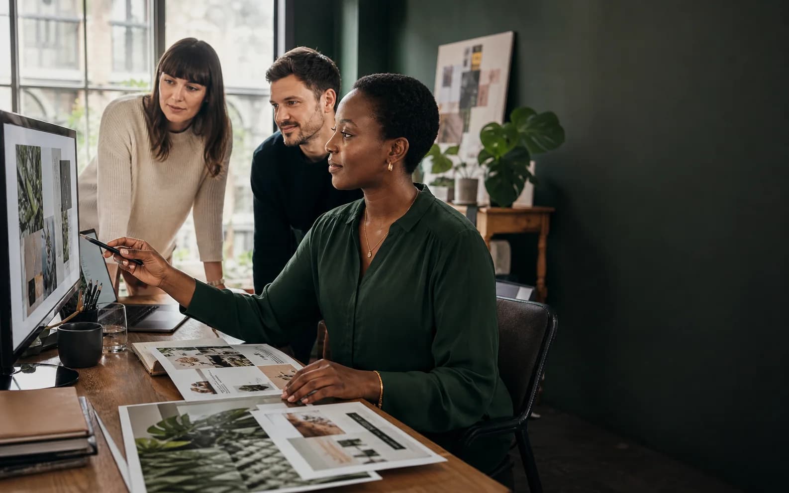 A brand team reviewing campaign work together before approval